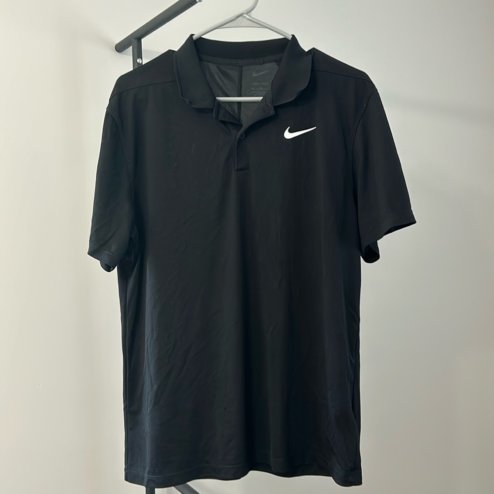 Men’s Nike dri-fit polo. Size M